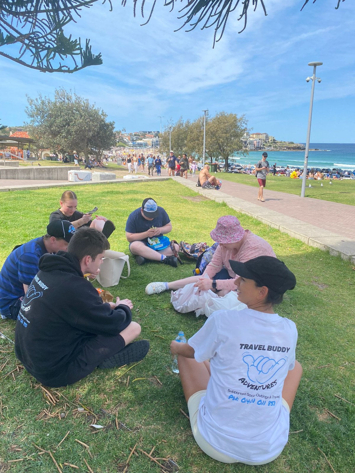 Guests enjoying Bondi to Coogee Walk, Swim, Fish & Chips & Yochi Day with Travel Buddy Adventures