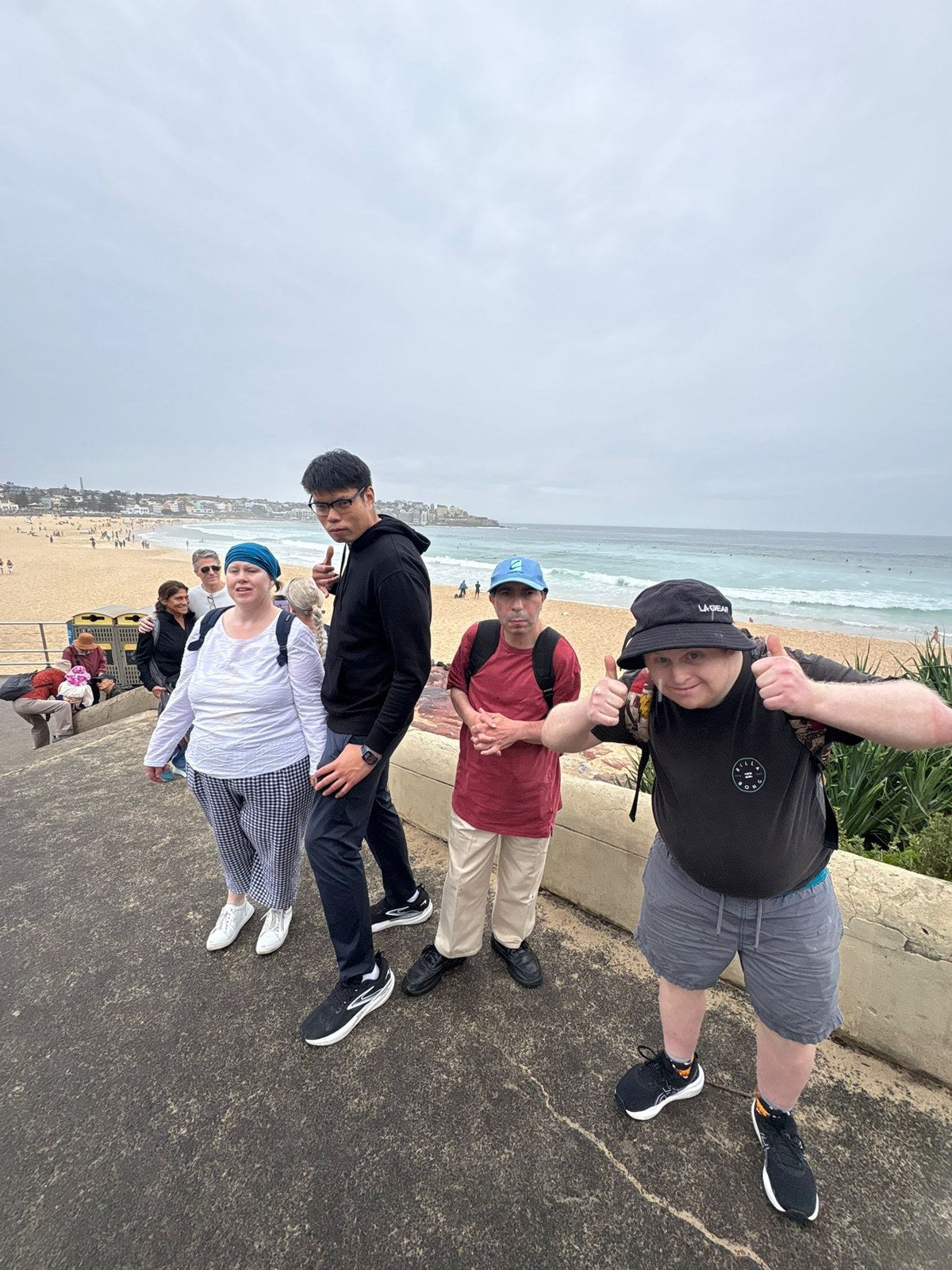 Guests enjoying Bondi to Coogee Walk, Swim, Fish & Chips & Yochi Day with Travel Buddy Adventures