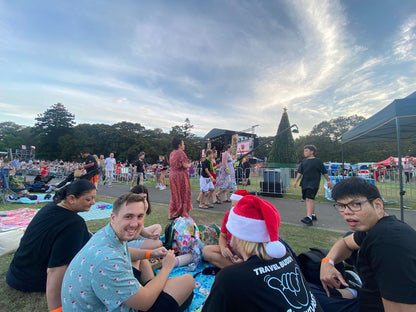 Guests enjoying Carols in the Domain with Travel Buddy Adventures