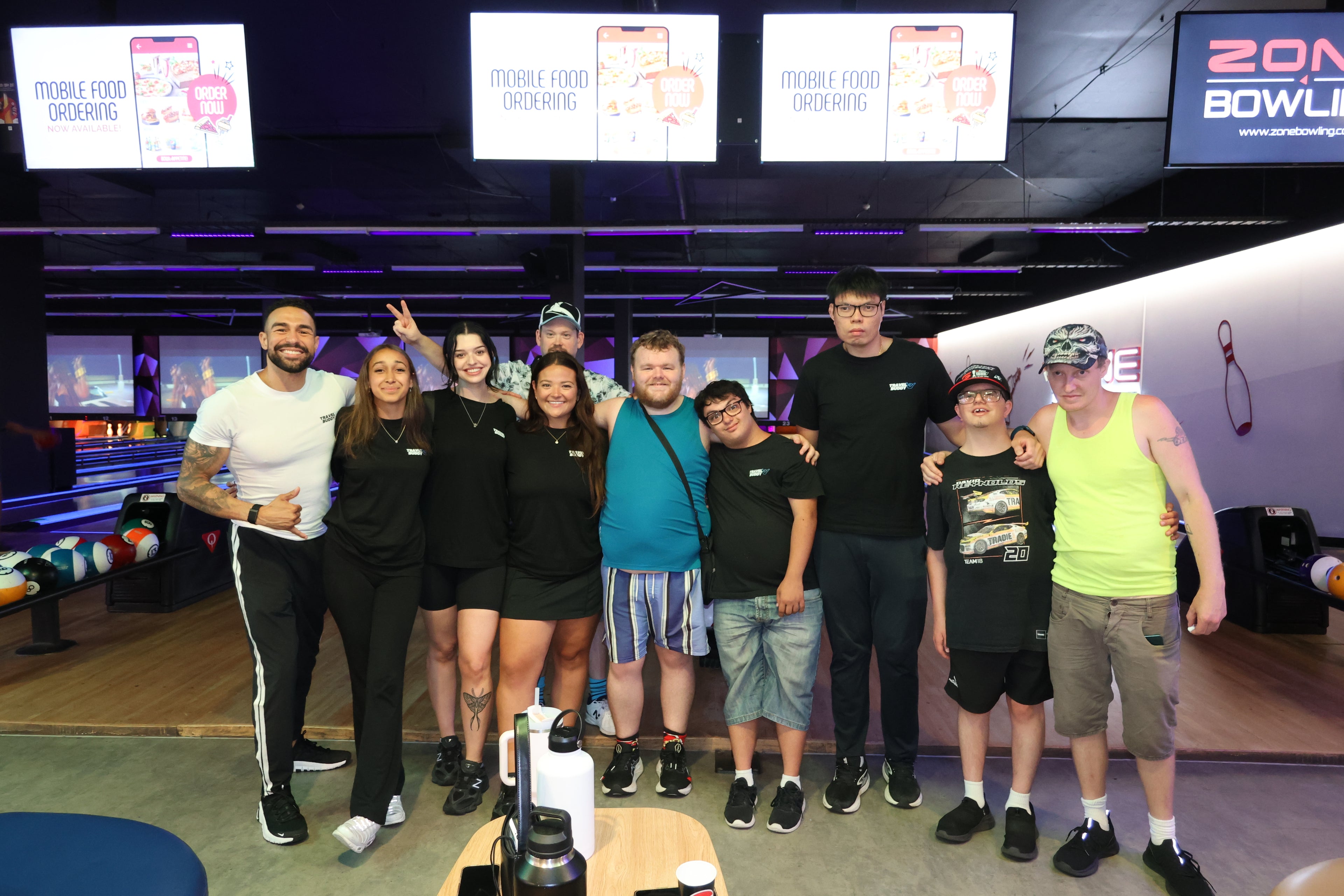 Guests bowling together at a Travel Buddy Adventures social night