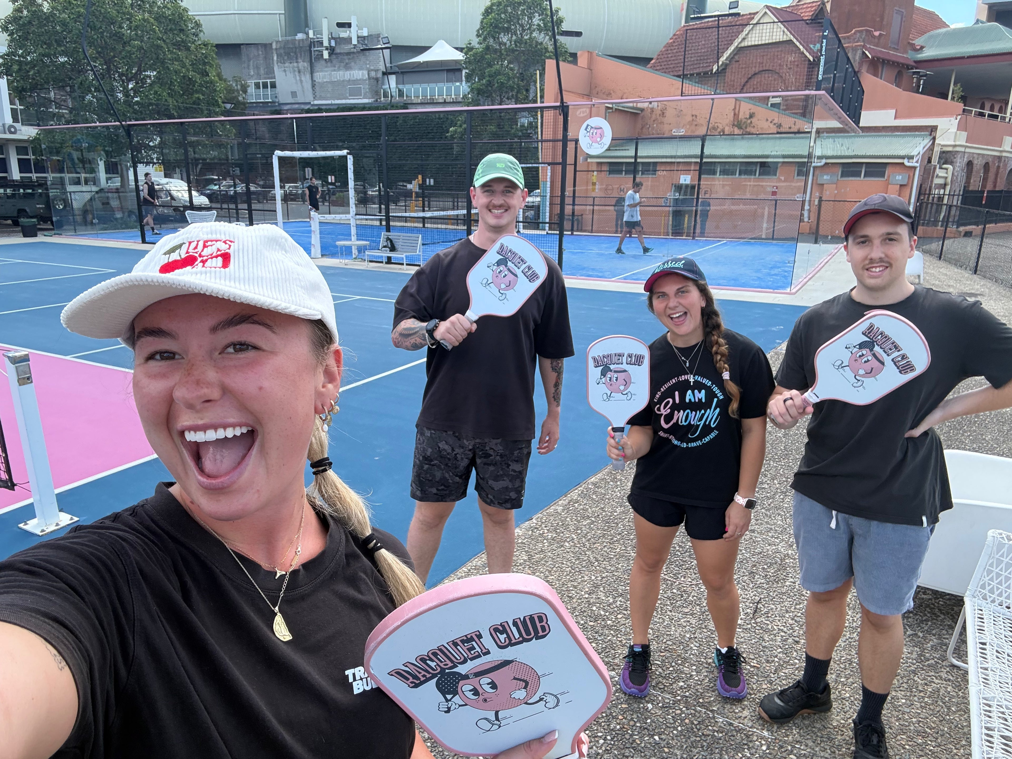 Guests playing pickleball with Travel Buddy Adventures