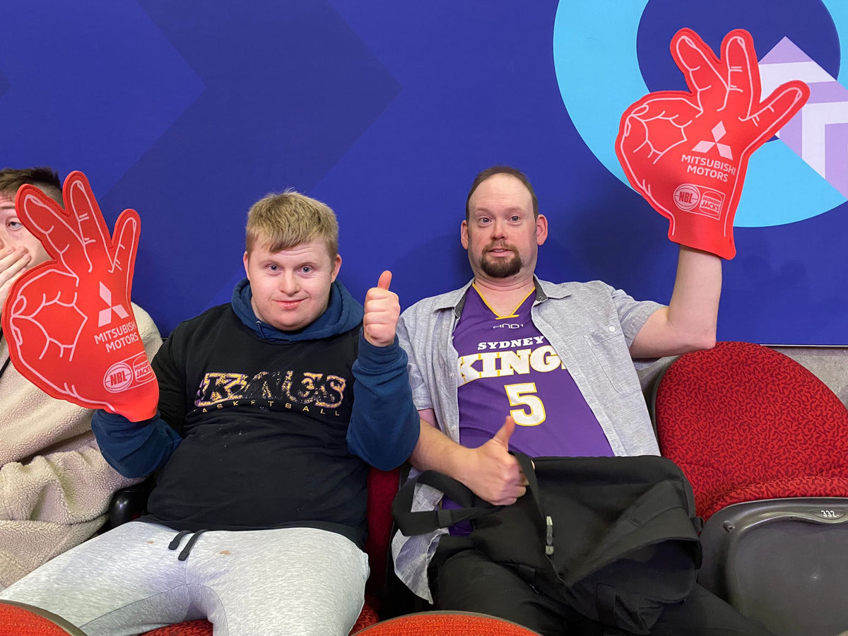 Guests at a Sydney Kings basketball game with Travel Buddy Adventures