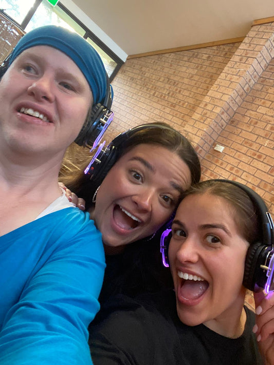 Guests wearing headphones at a Travel Buddy Adventures silent disco