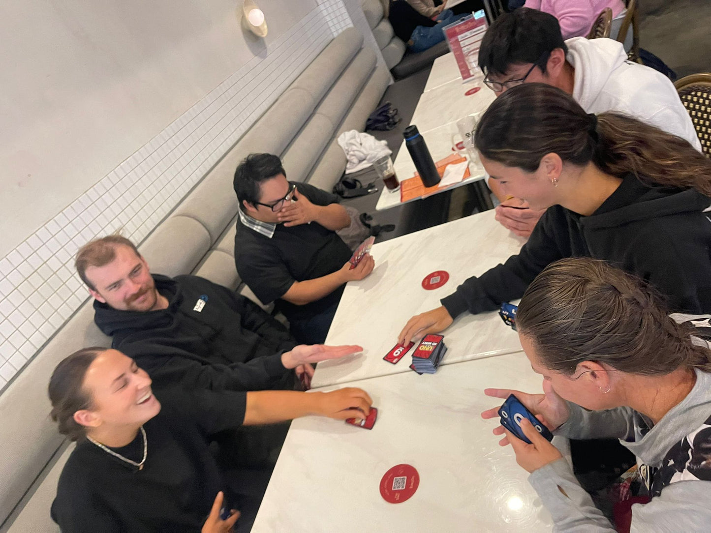 Guests together at a Travel Buddy Adventures dinner and games night